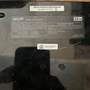 Wii U gaming system with 4 controllers, 2 nunchucks, 5 games, and everything els